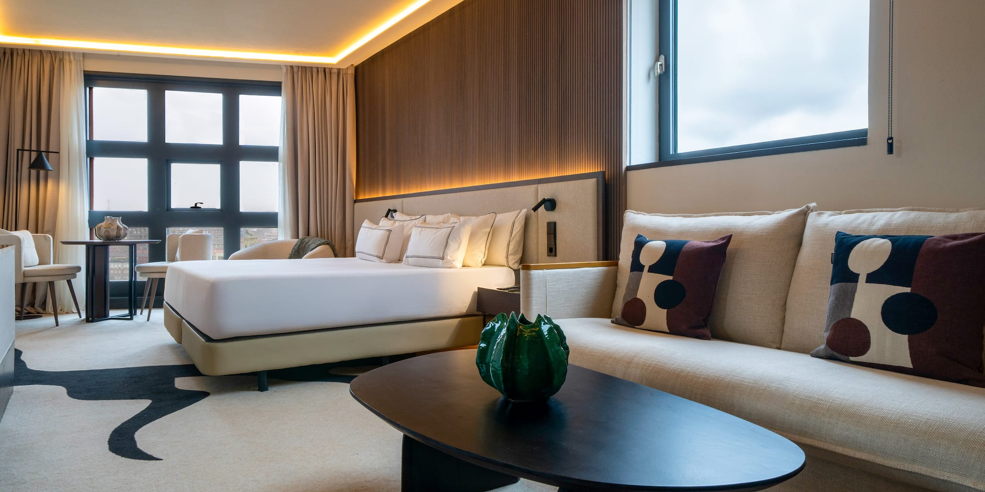 a room with two beds and a table