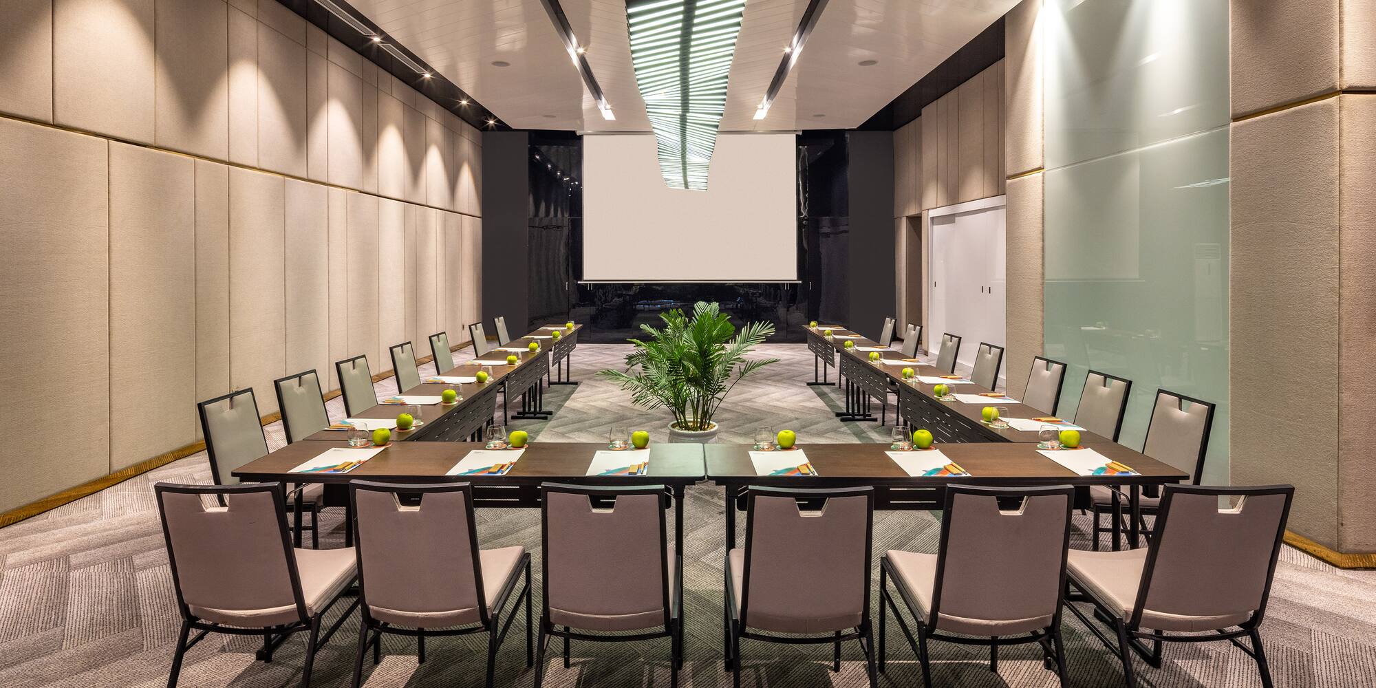 a room with a large table and chairs