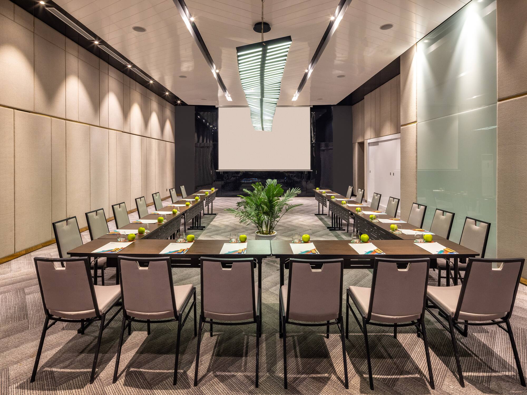 a room with a large table and chairs