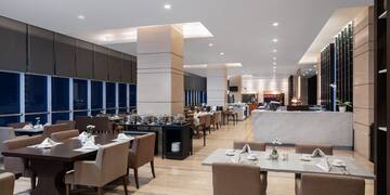 a restaurant with tables and chairs