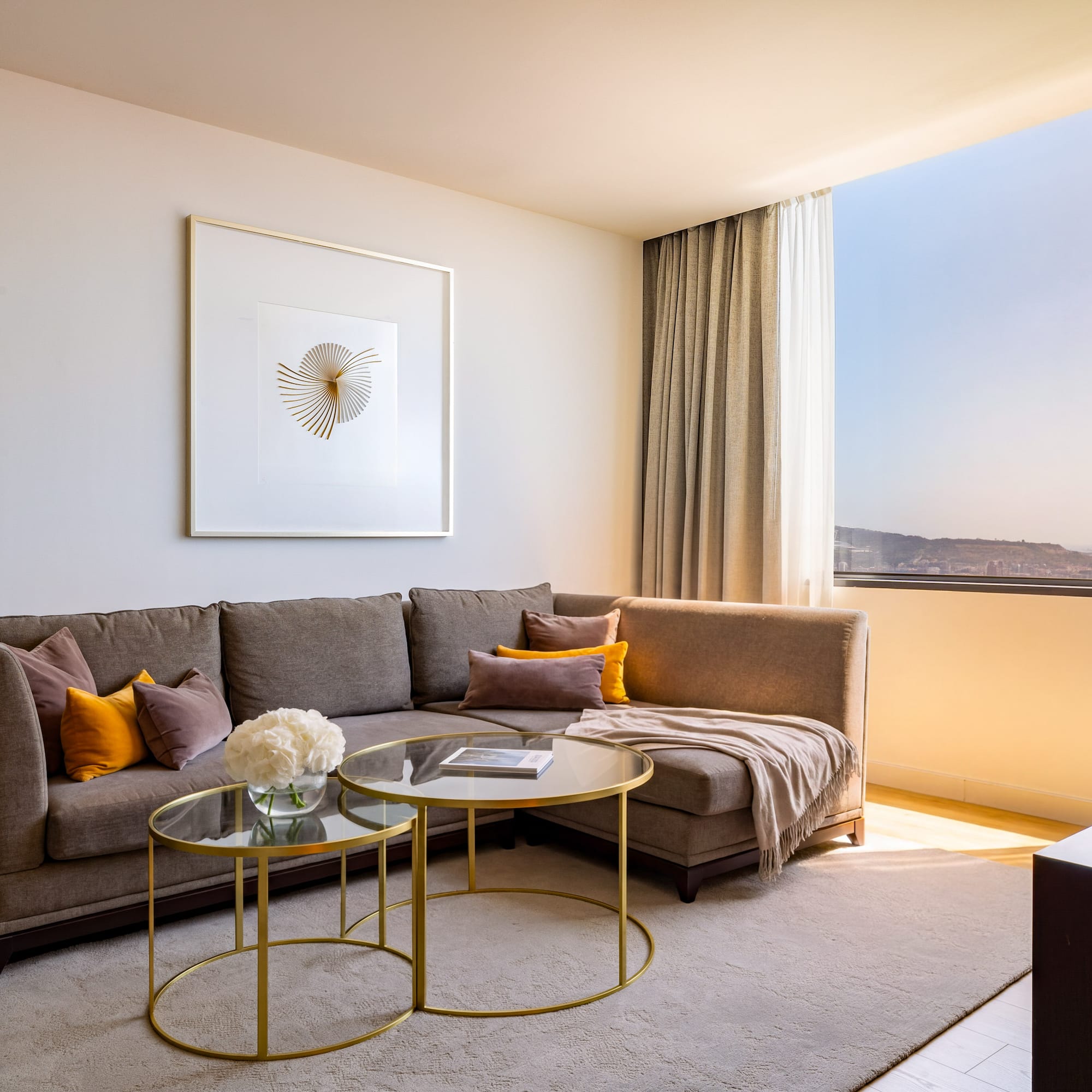 Stylish living room with brown sectional, modern art, and sunny window city view.