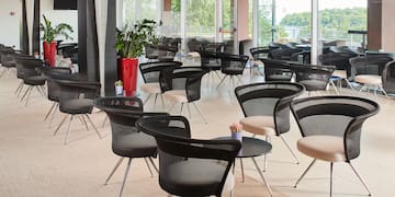 a room with chairs and tables