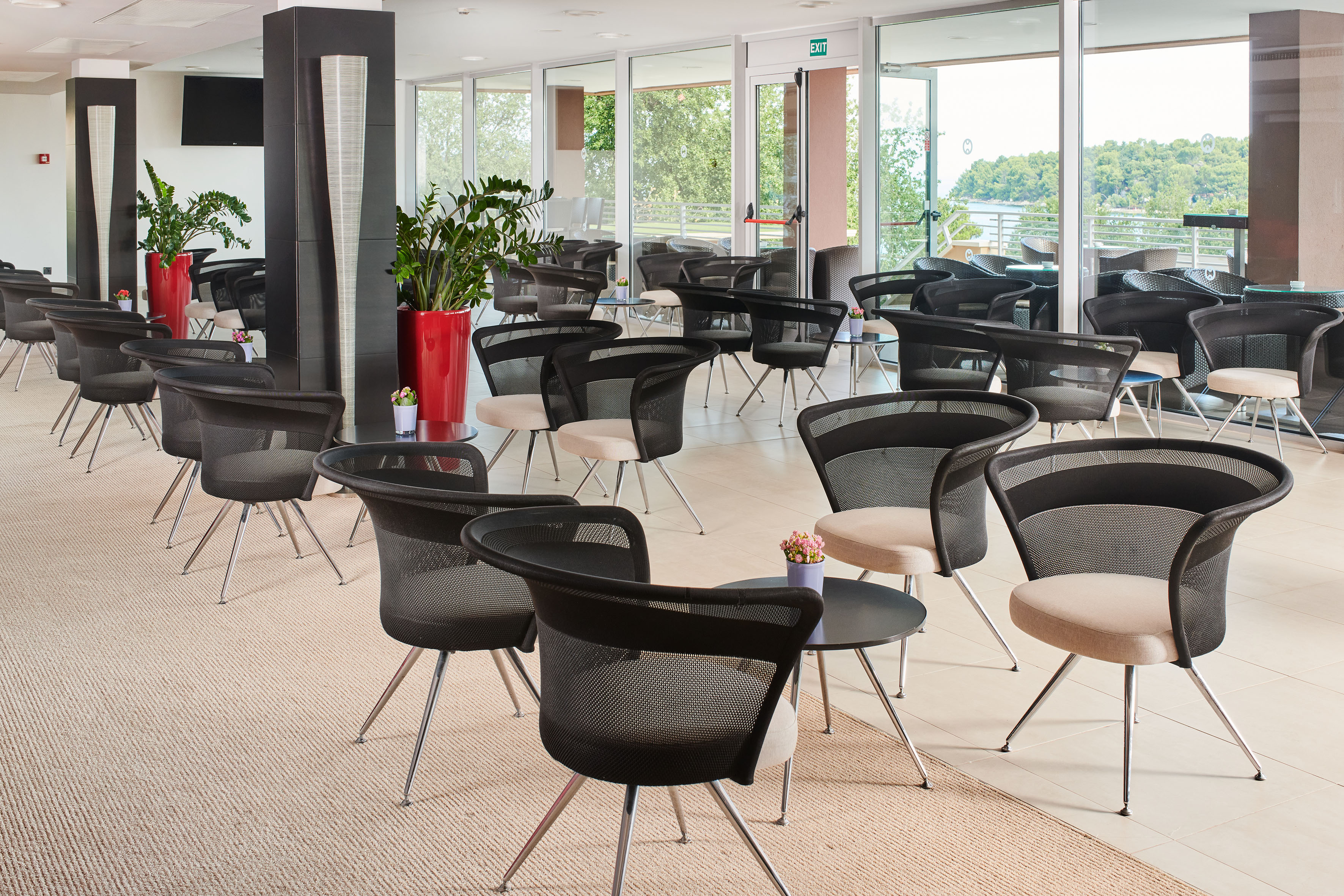 a room with chairs and tables