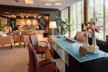 a room with a glass table and chairs