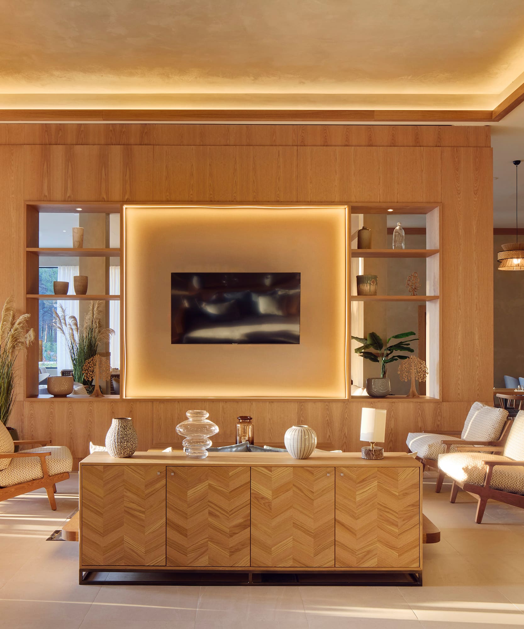 a room with a tv and chairs