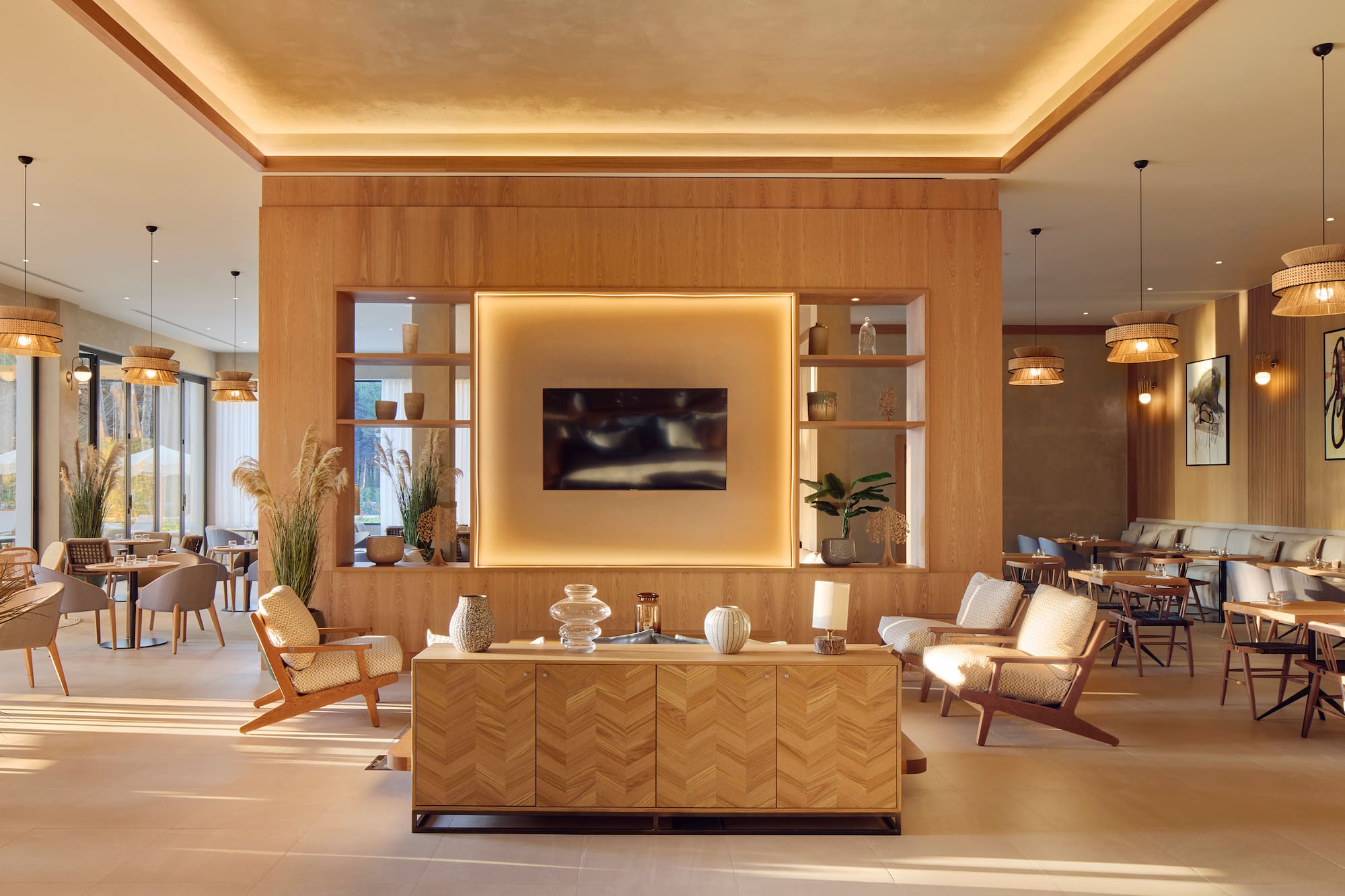 a room with a tv and chairs