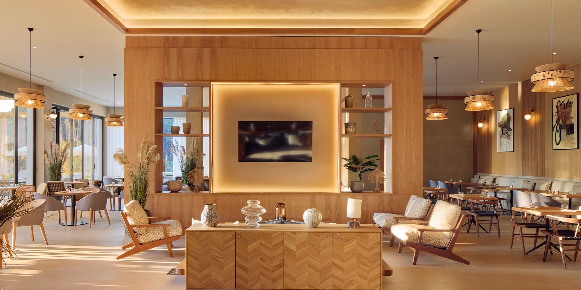 a room with a tv and chairs