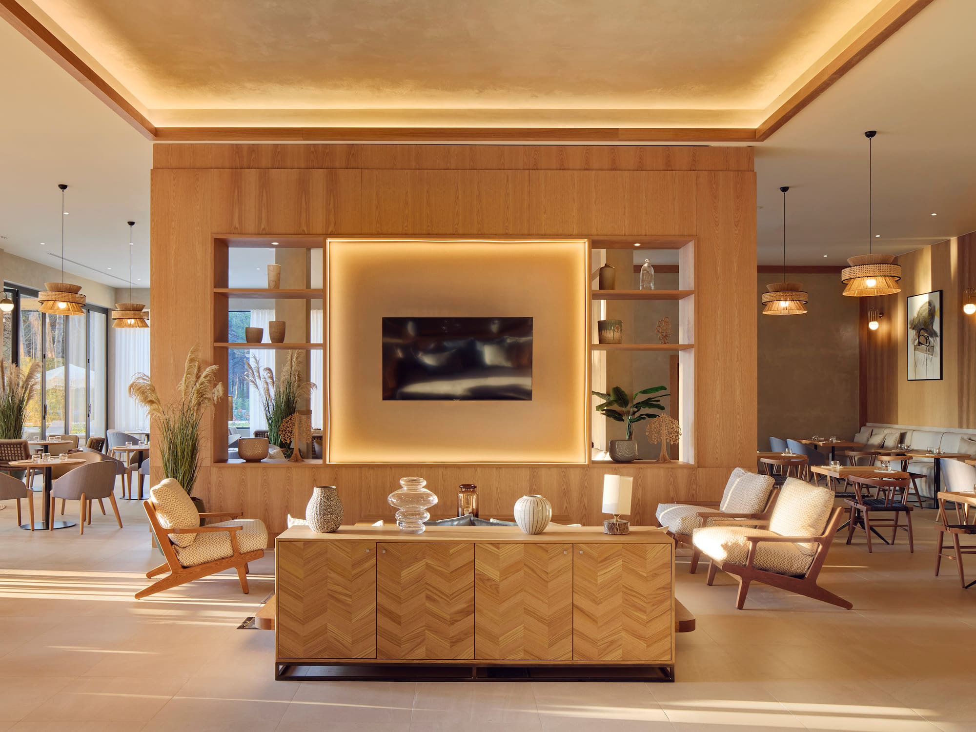 a room with a tv and chairs