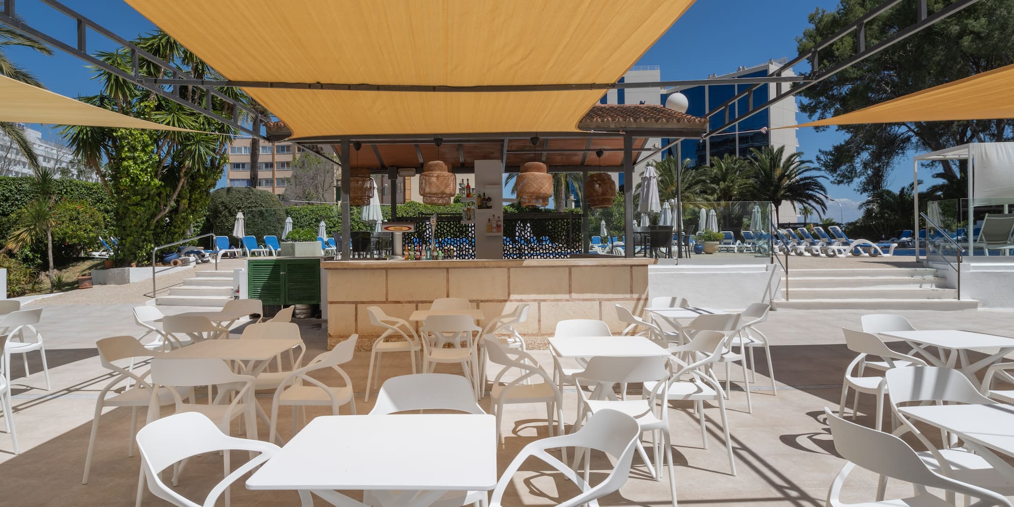 a white tables and chairs on a patio