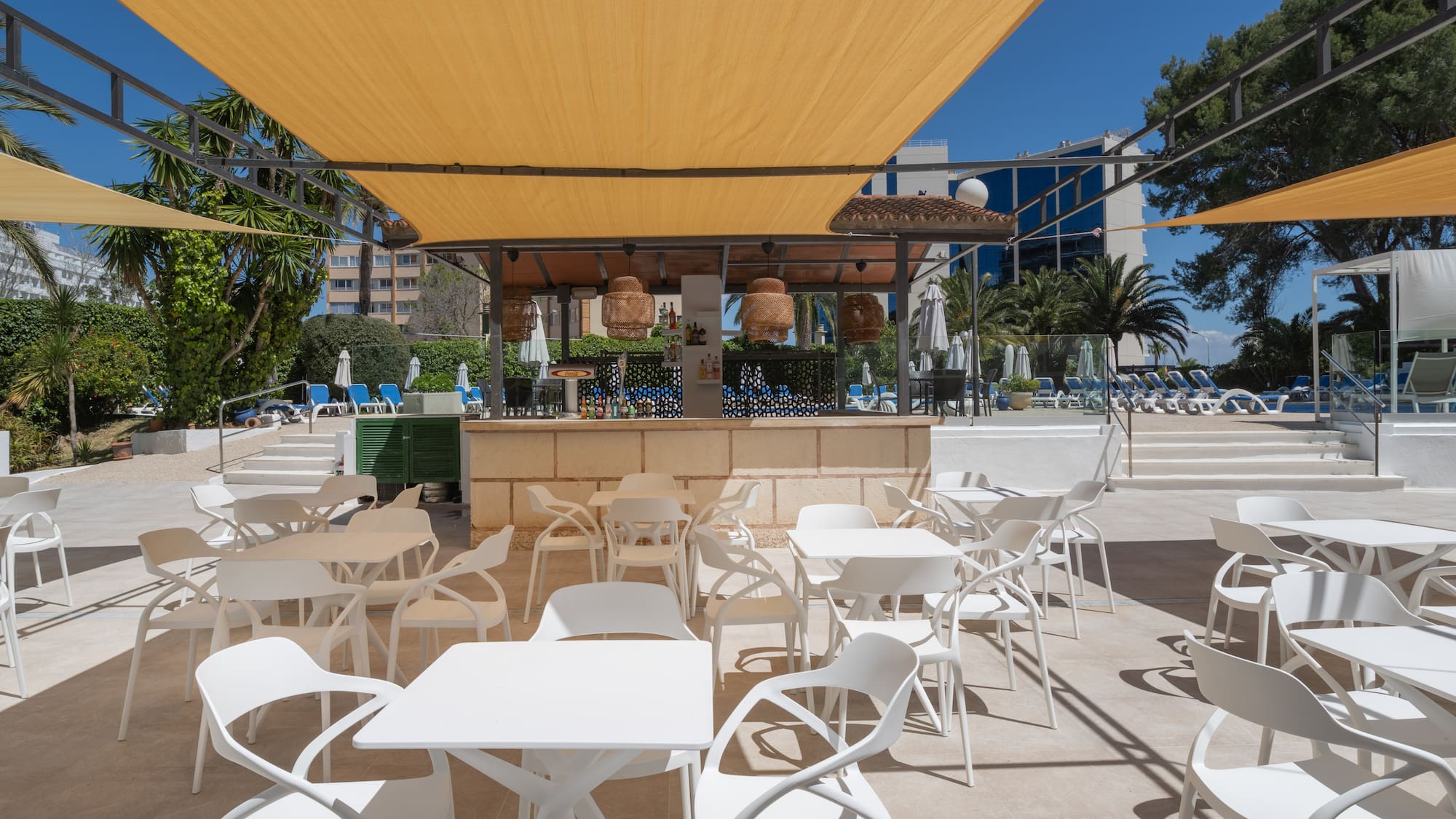 a white tables and chairs on a patio