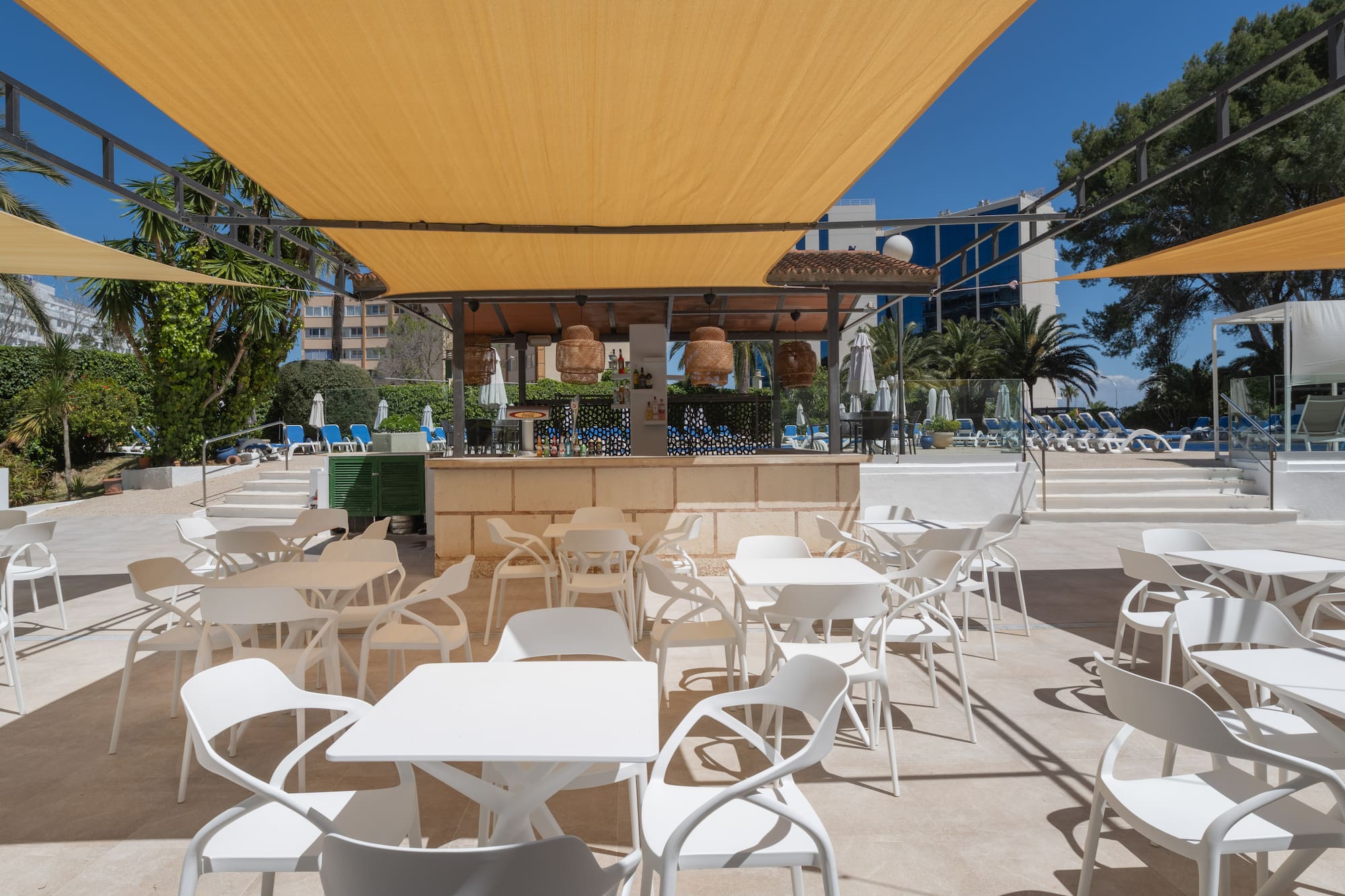 a white tables and chairs on a patio