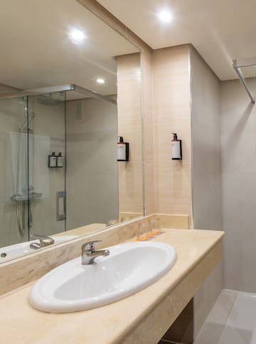 a bathroom with a mirror and sink