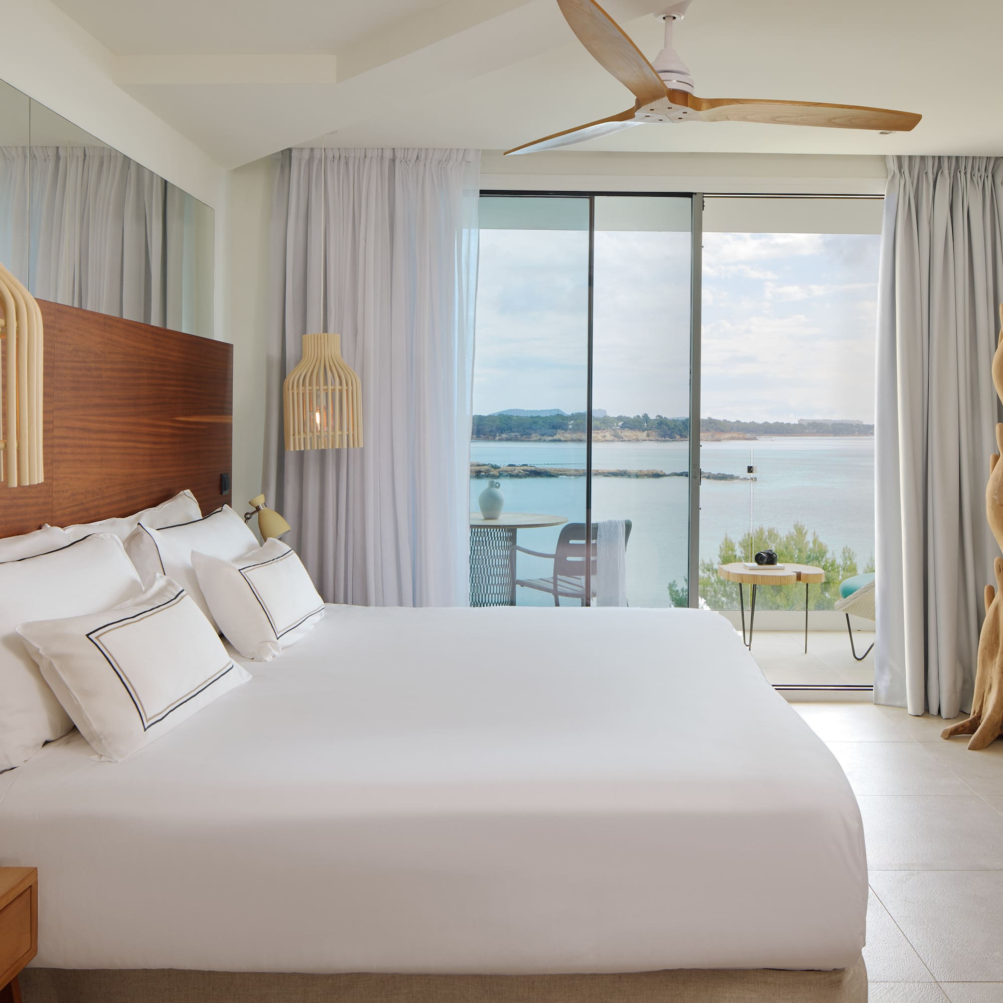 a room with a large bed and a large window