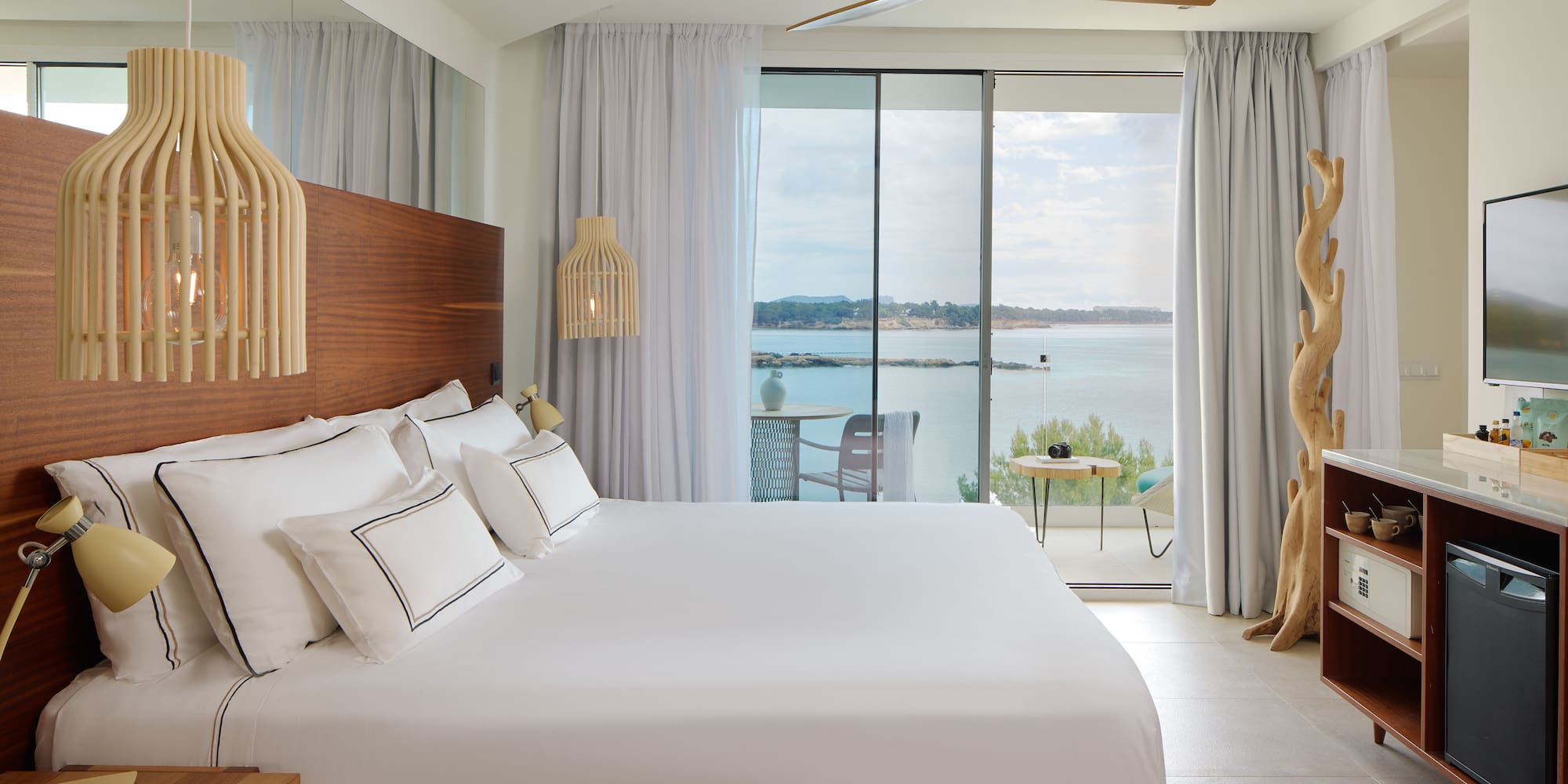 a room with a large bed and a large window