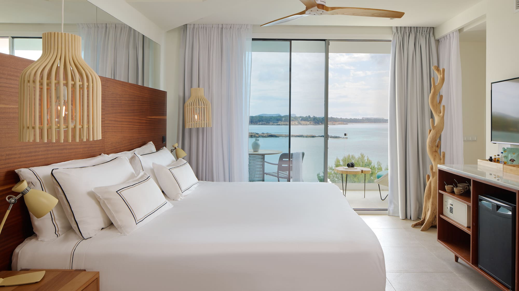 a room with a large bed and a large window