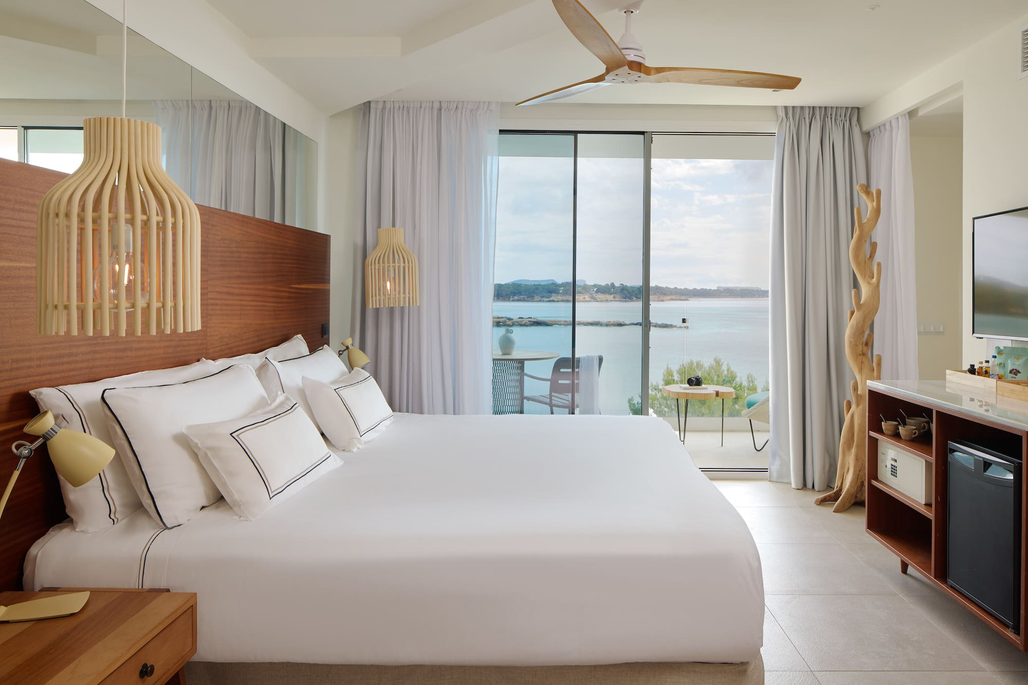 a room with a large bed and a large window