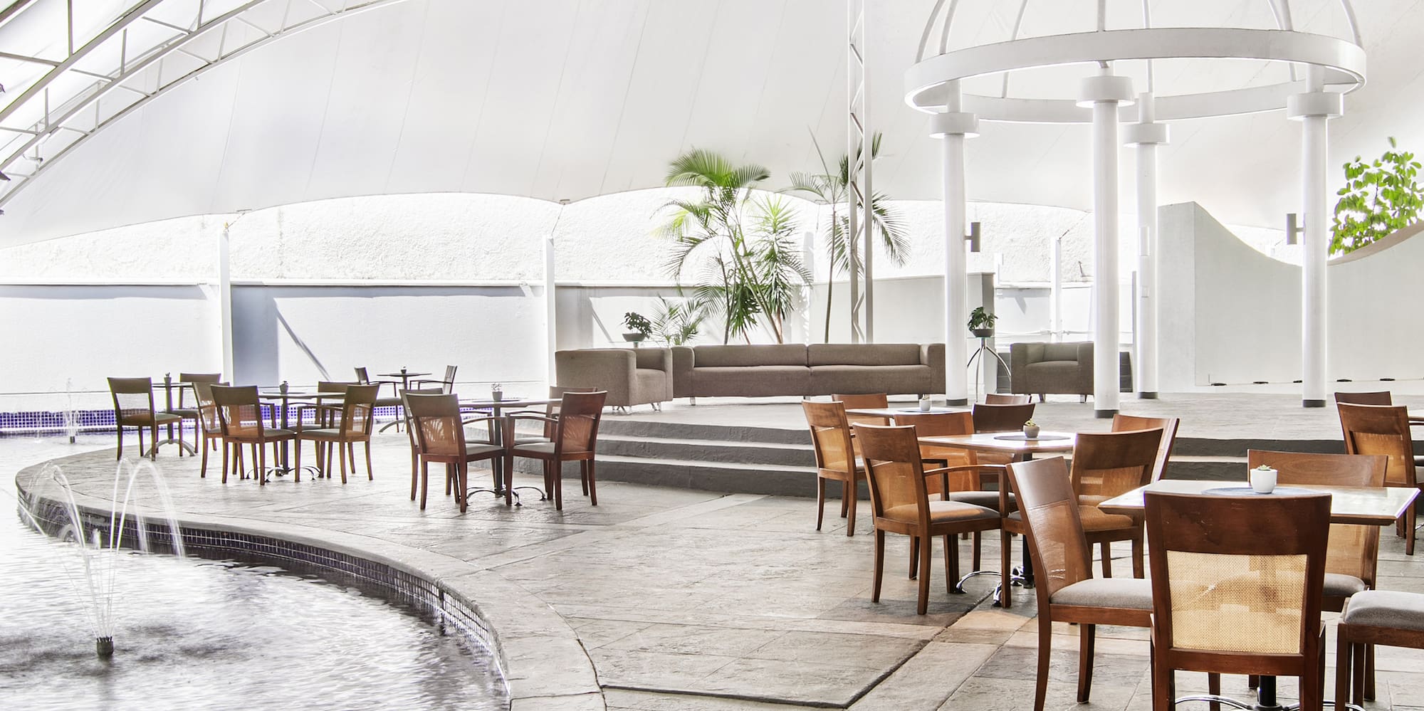 a pool with tables and chairs