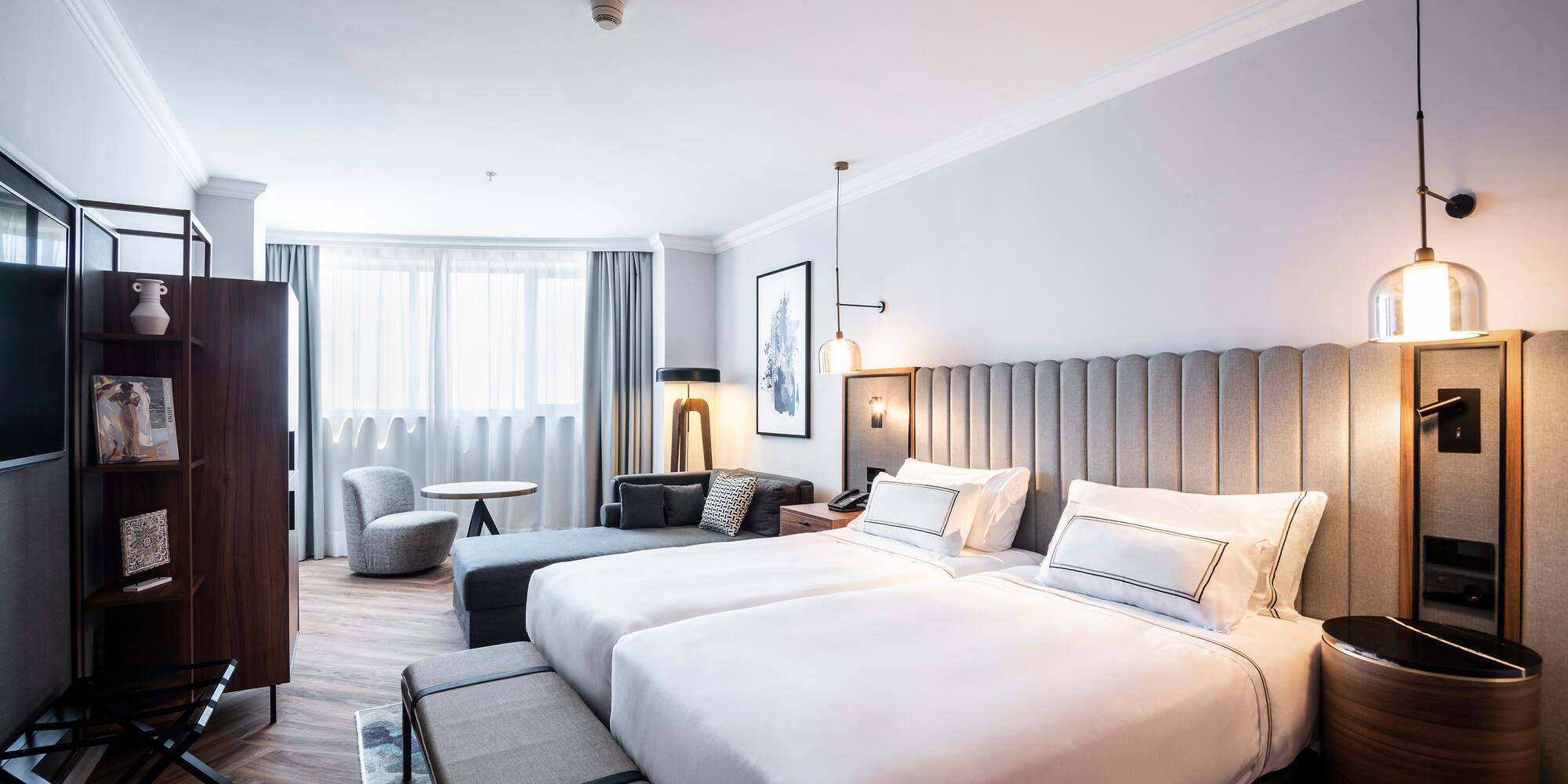 a room with two beds and a table