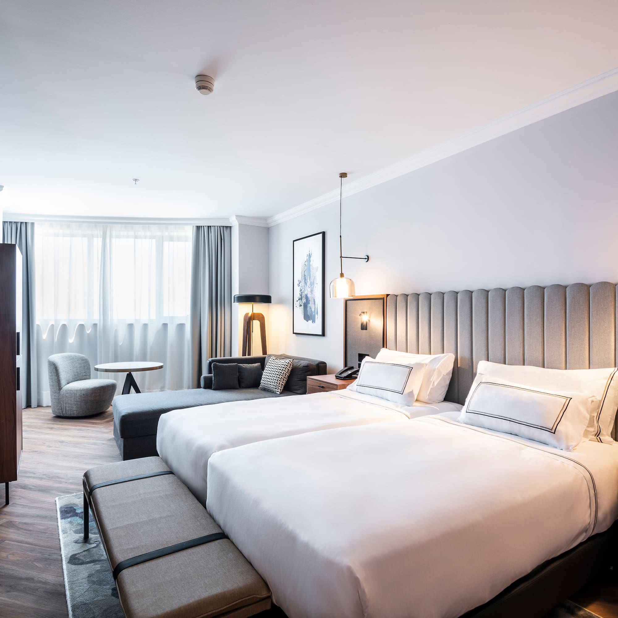 a room with two beds and a table