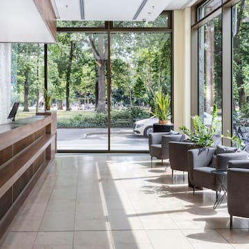 a lobby with a reception desk and chairs