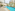 a swimming pool with a fountain in the middle of it