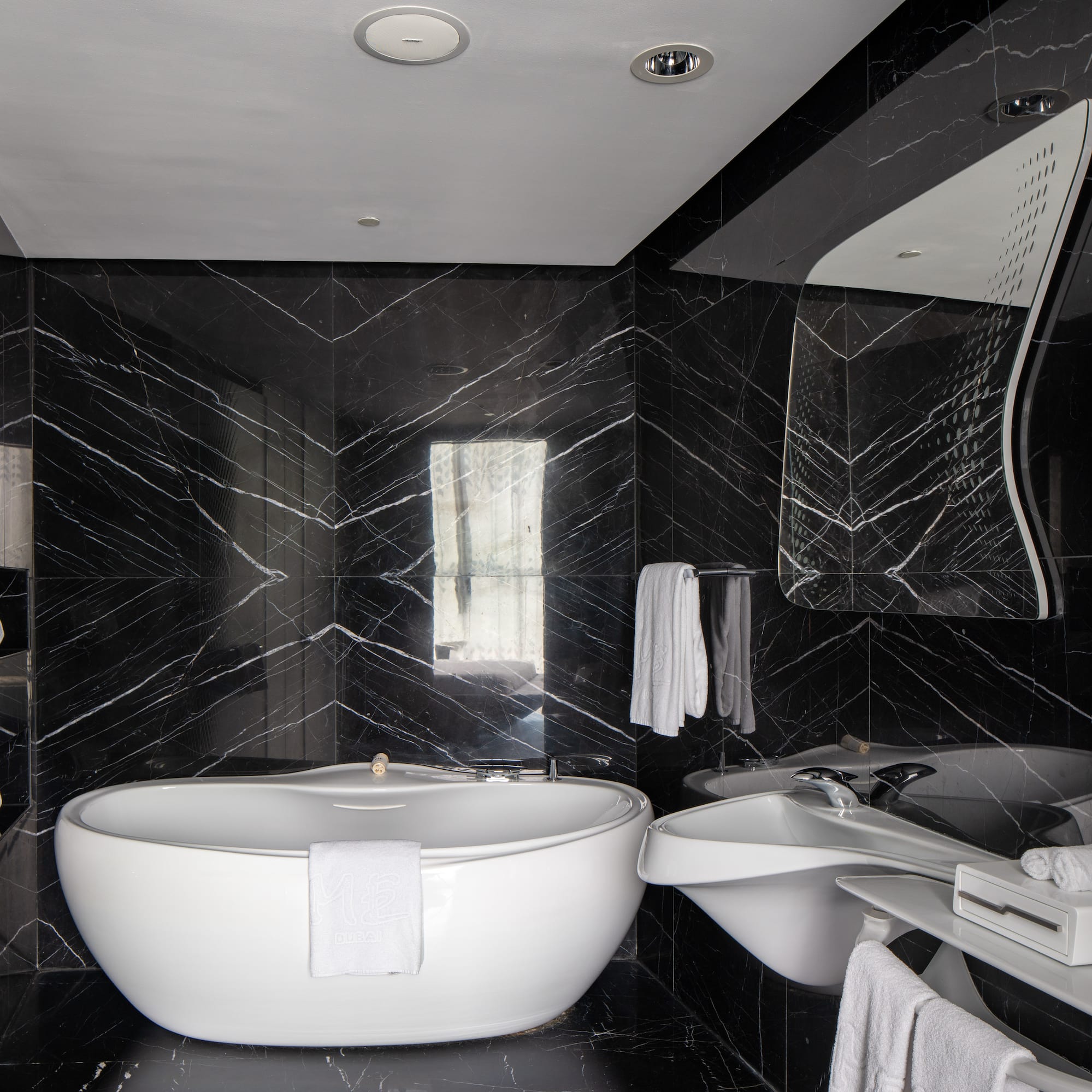 a bathroom with a tub and sink