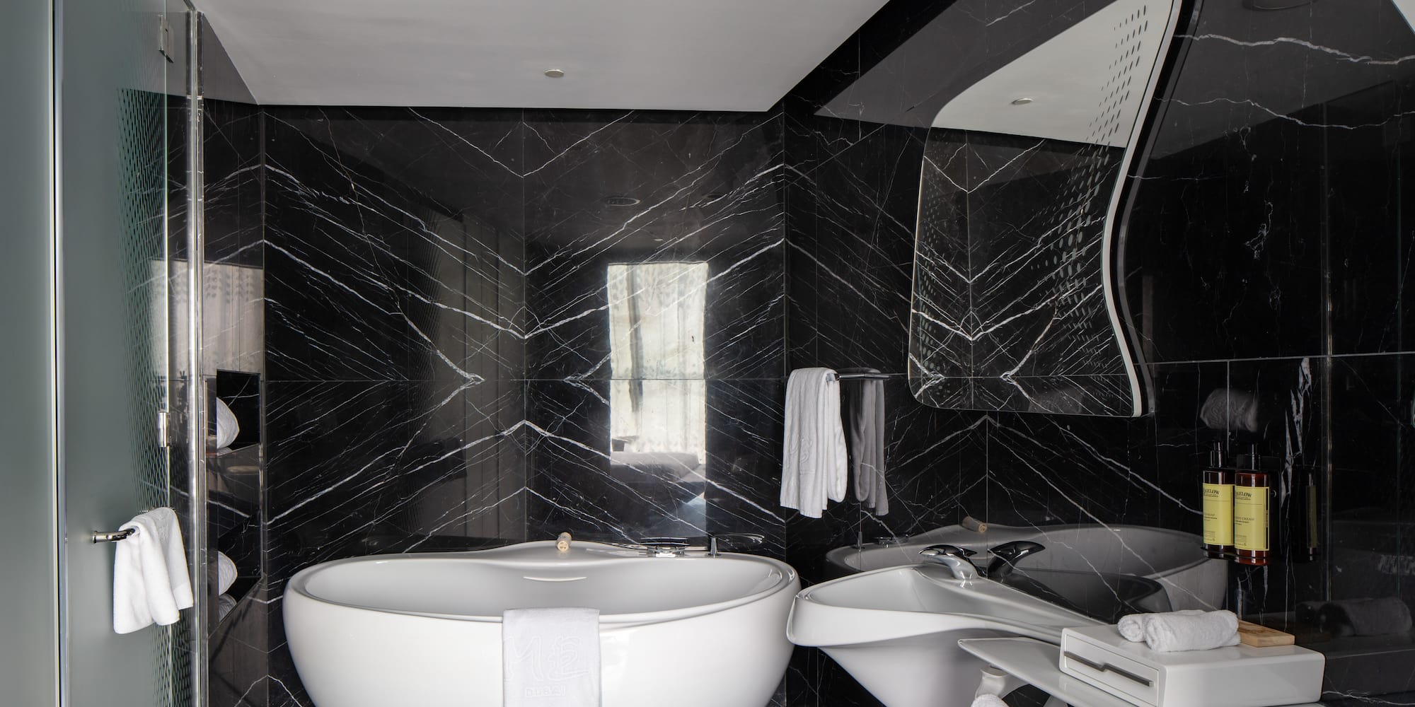 a bathroom with a tub and sink