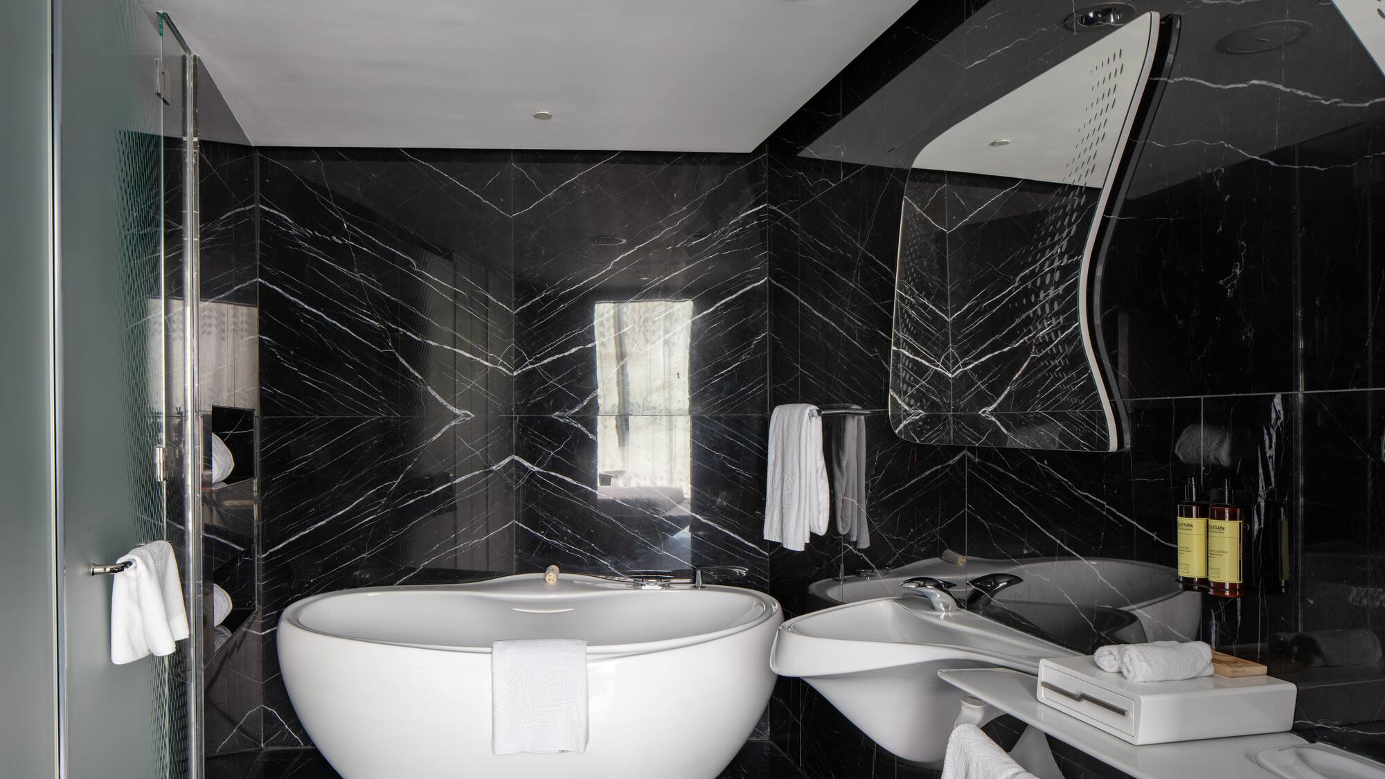 a bathroom with a tub and sink