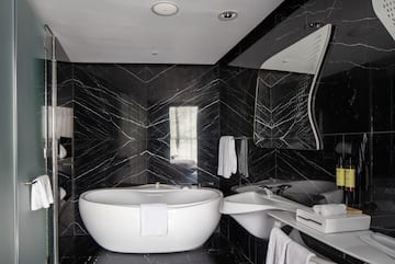 a bathroom with a tub and sink