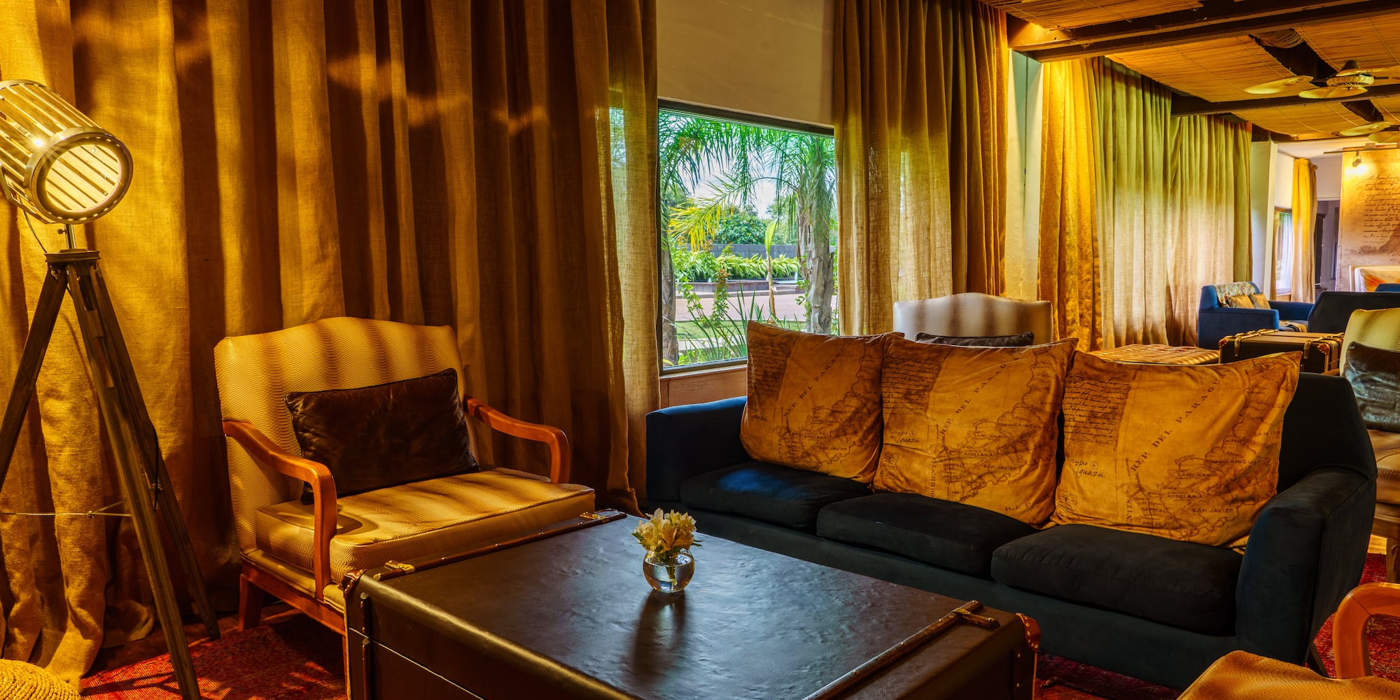 a living room with couches and chairs