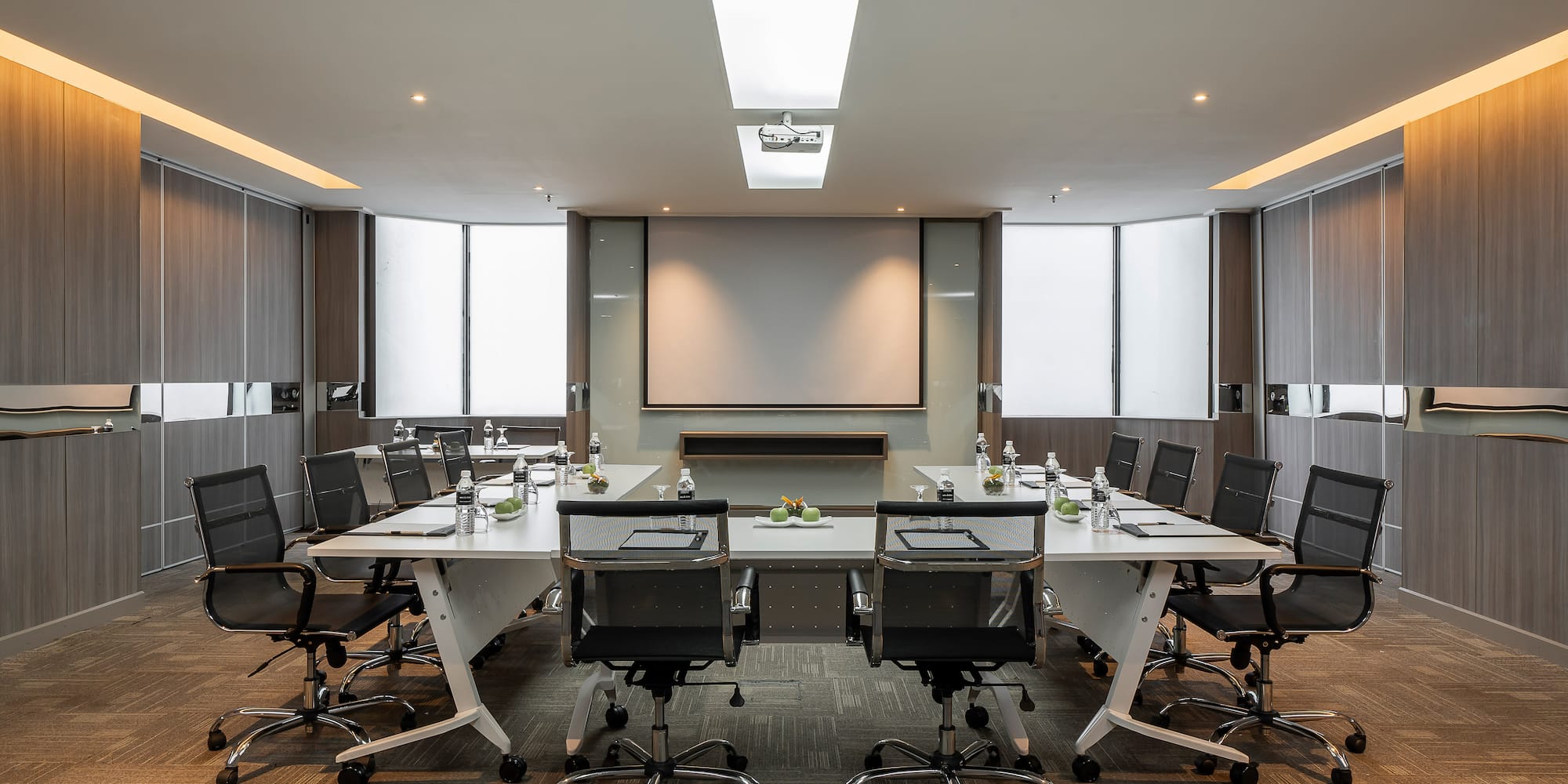 a conference room with a table and chairs