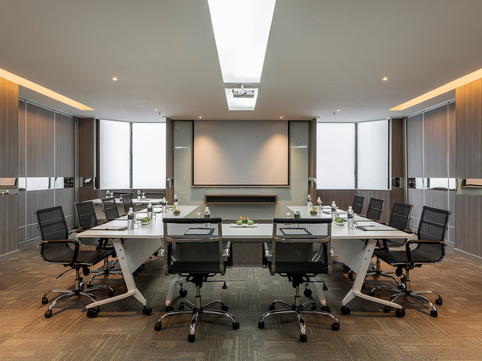 a conference room with a table and chairs