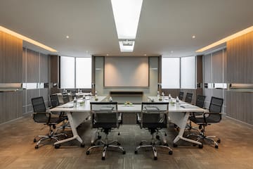 a conference room with a table and chairs