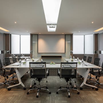 a conference room with a table and chairs