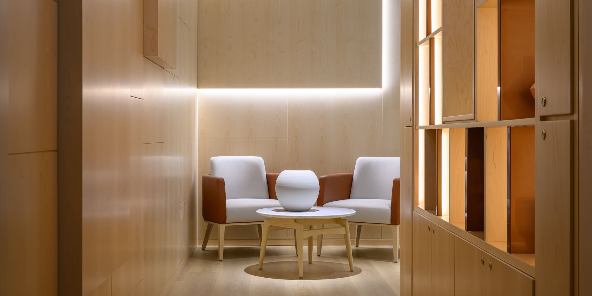 a room with a round table and chairs