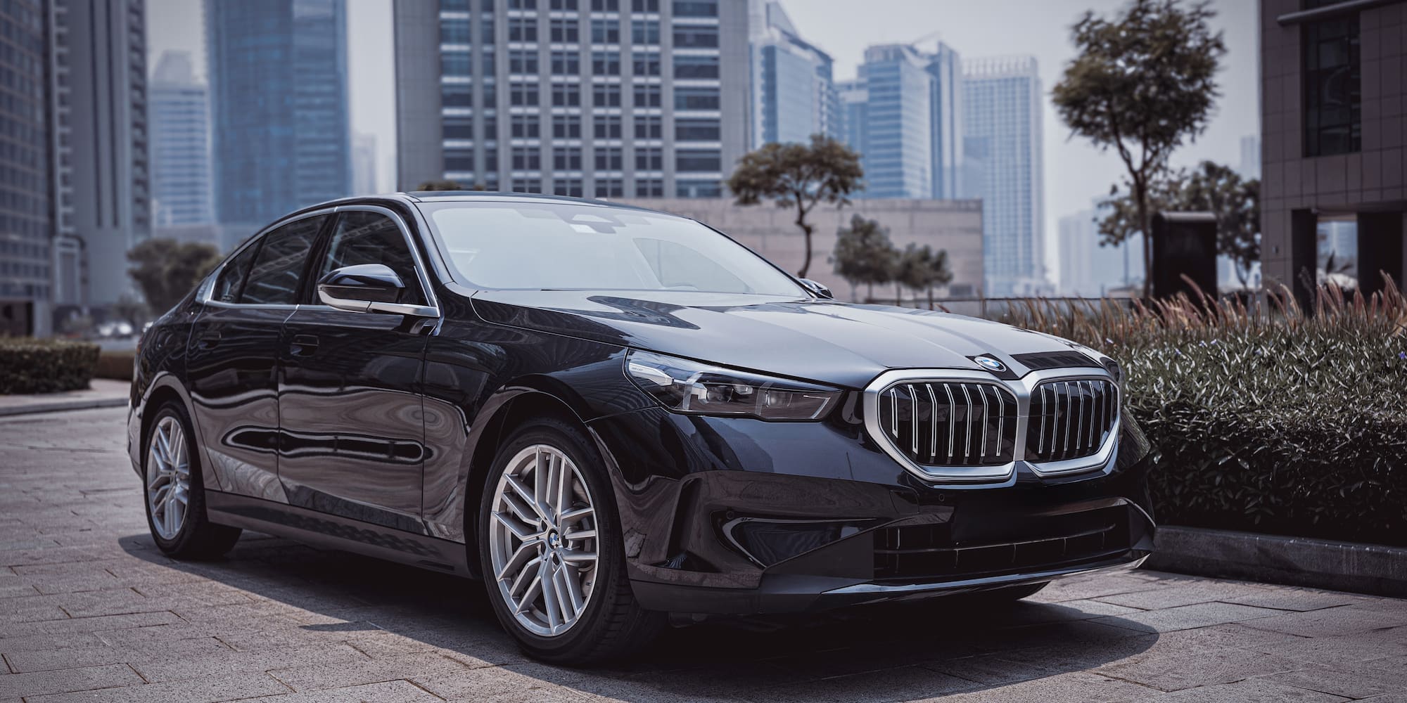 a black car parked on a brick surface