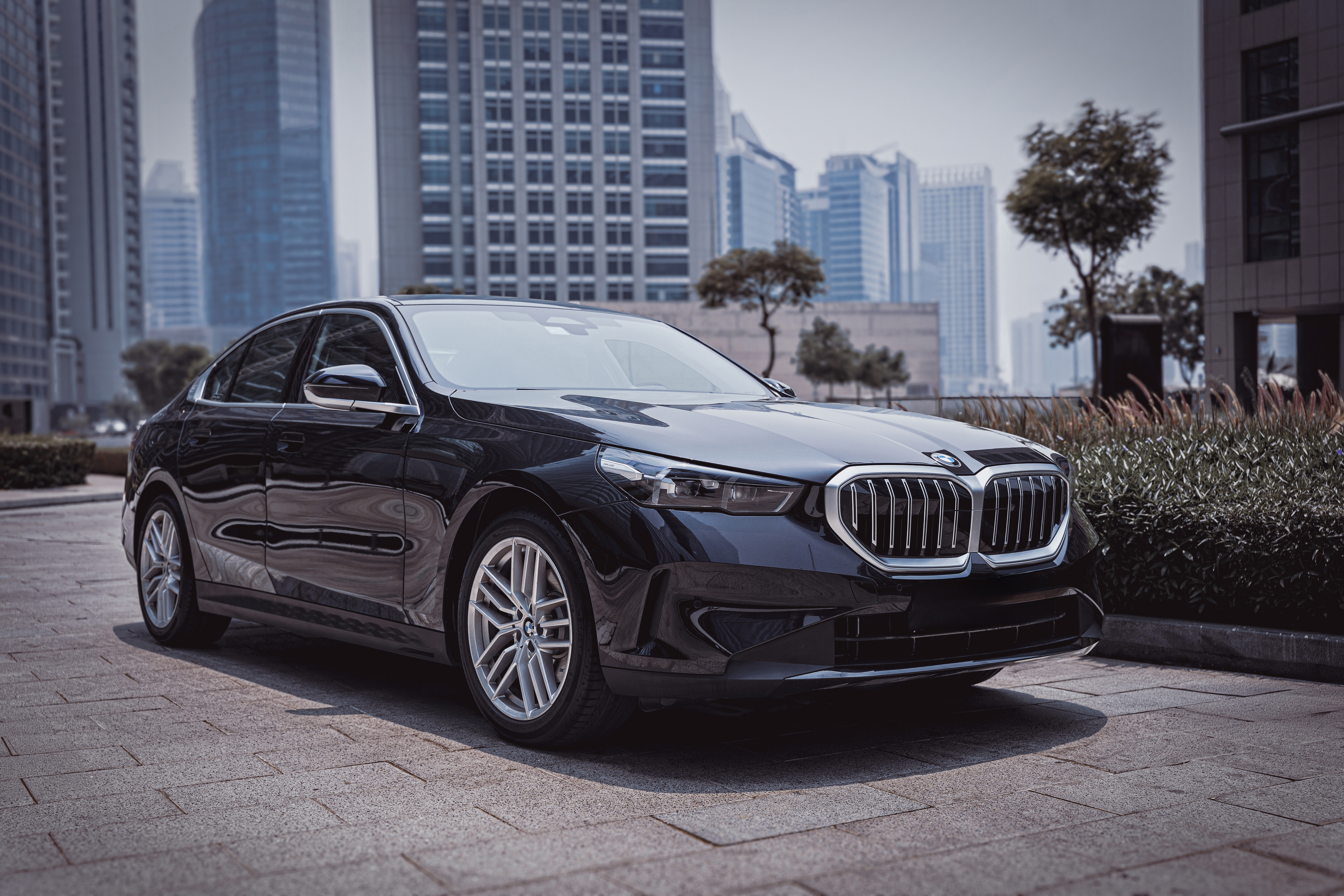 a black car parked on a brick surface