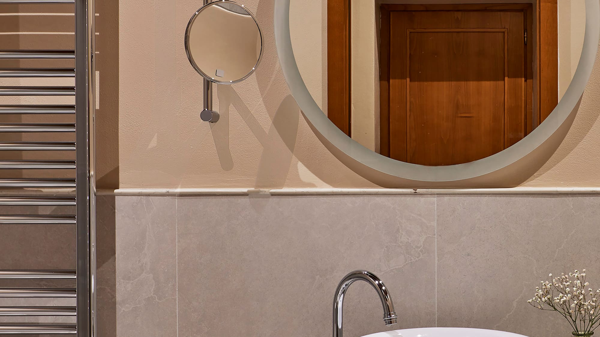 a mirror above a sink