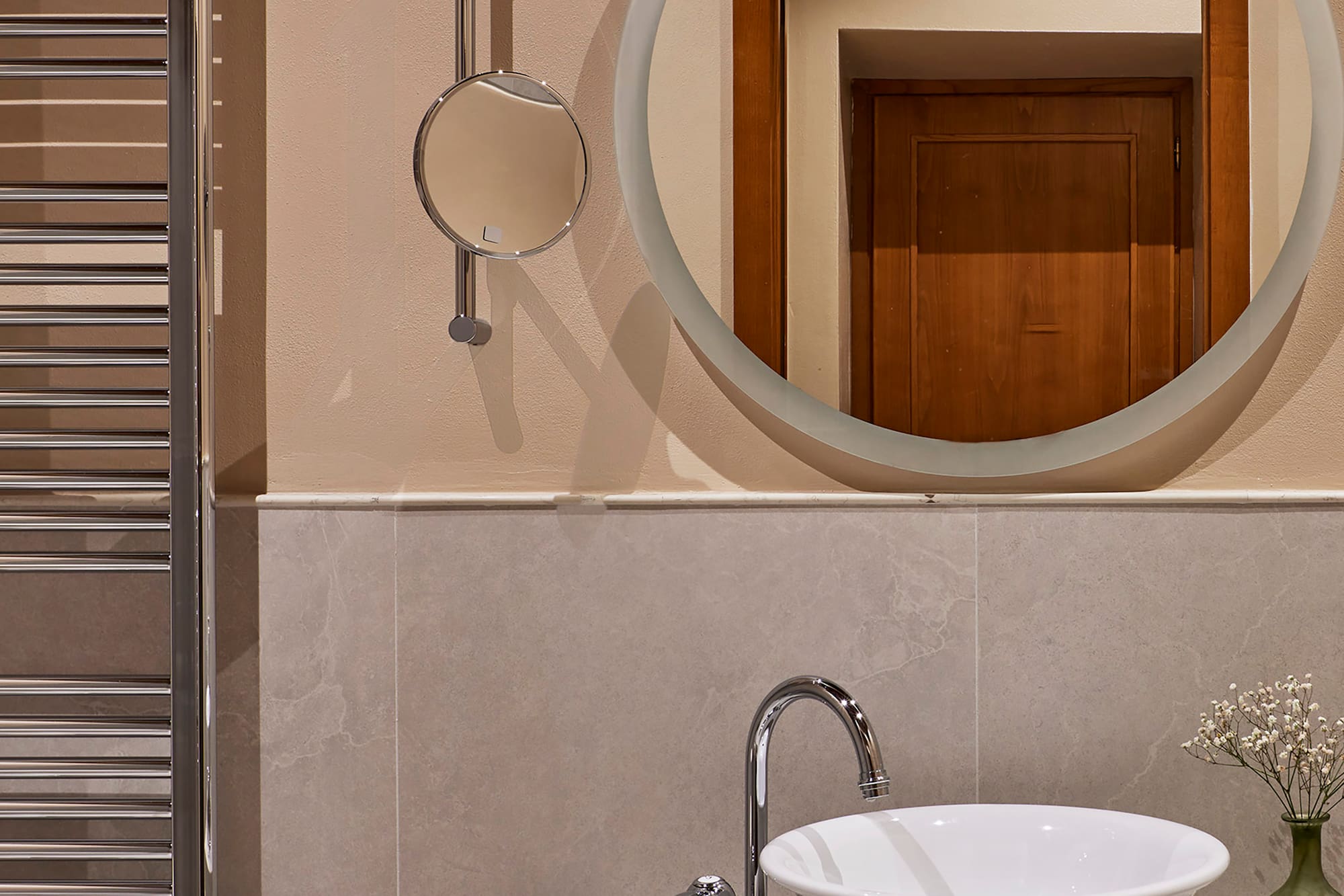 a mirror above a sink