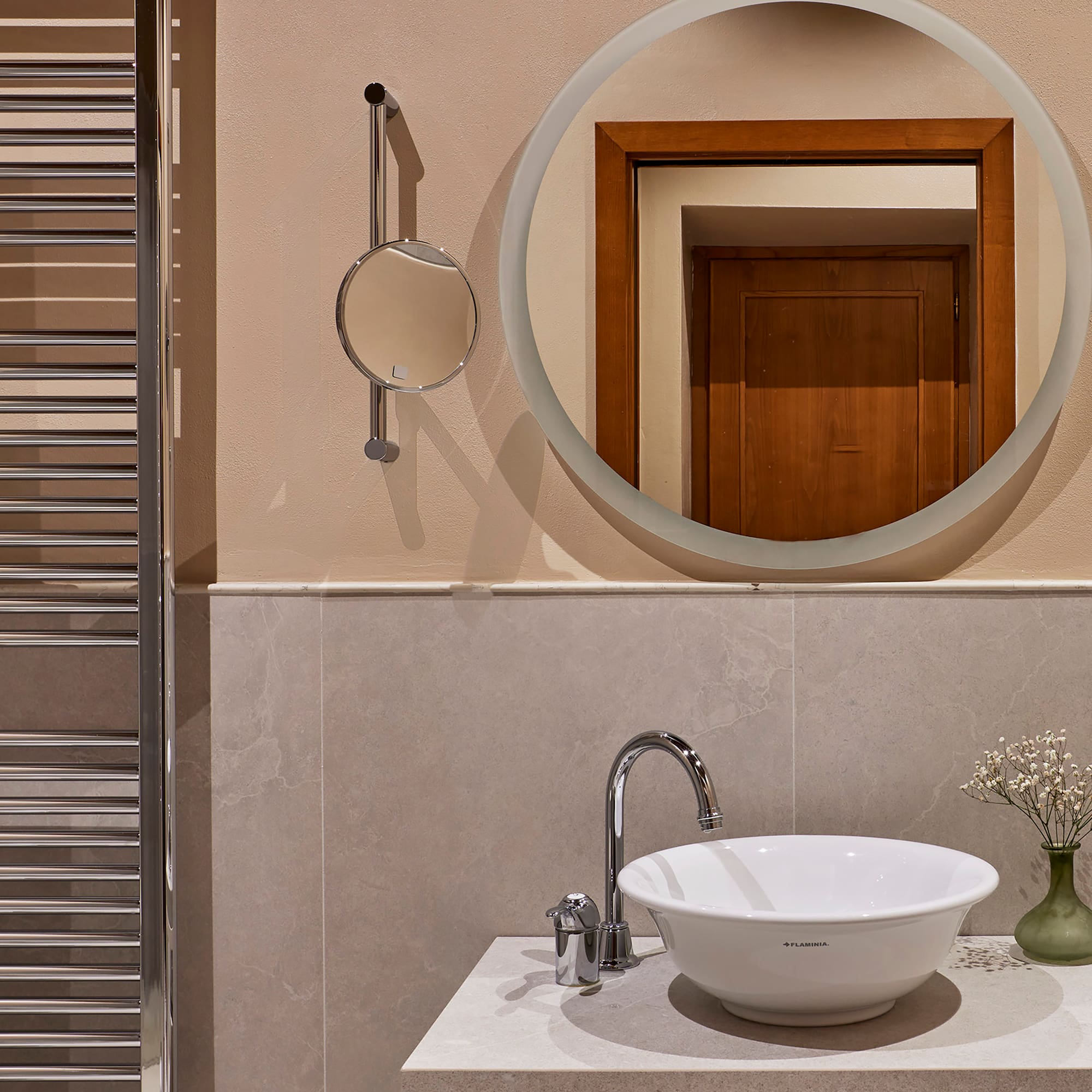 a mirror above a sink