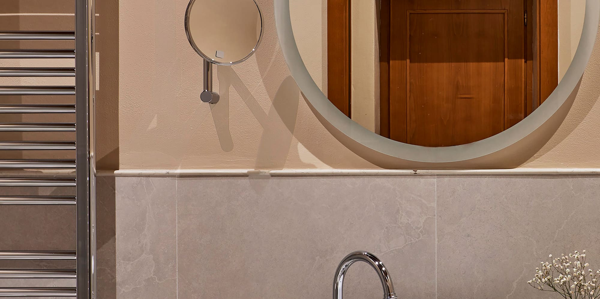 a mirror above a sink