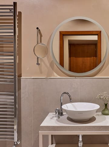 a mirror above a sink