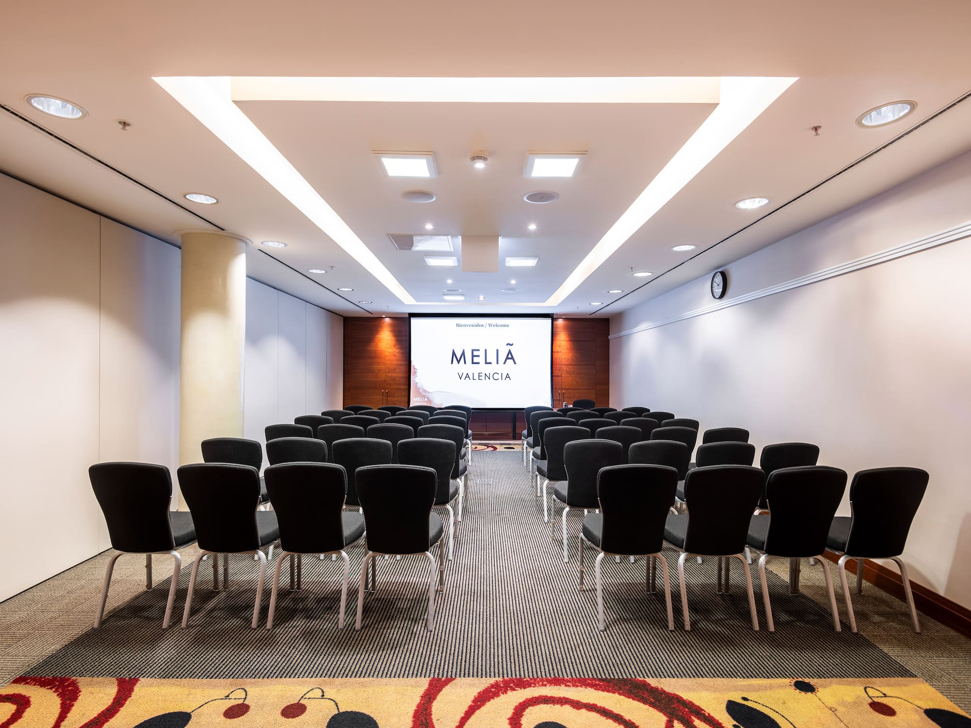 a room with rows of chairs