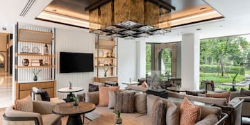 a room with a couch and tables