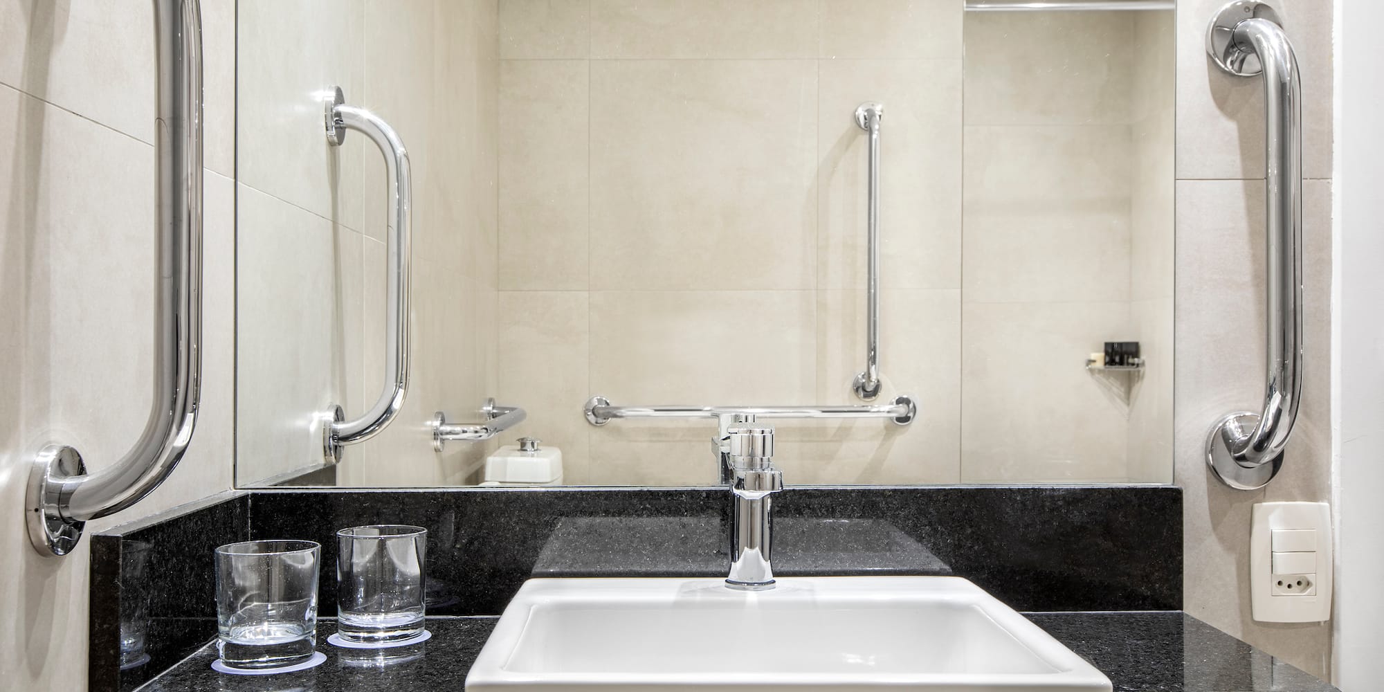 a sink and a mirror in a bathroom