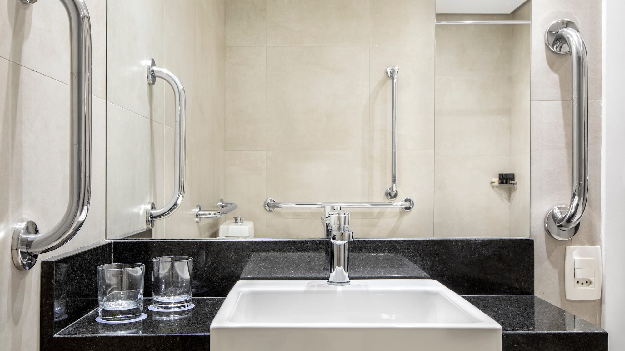 a sink and a mirror in a bathroom