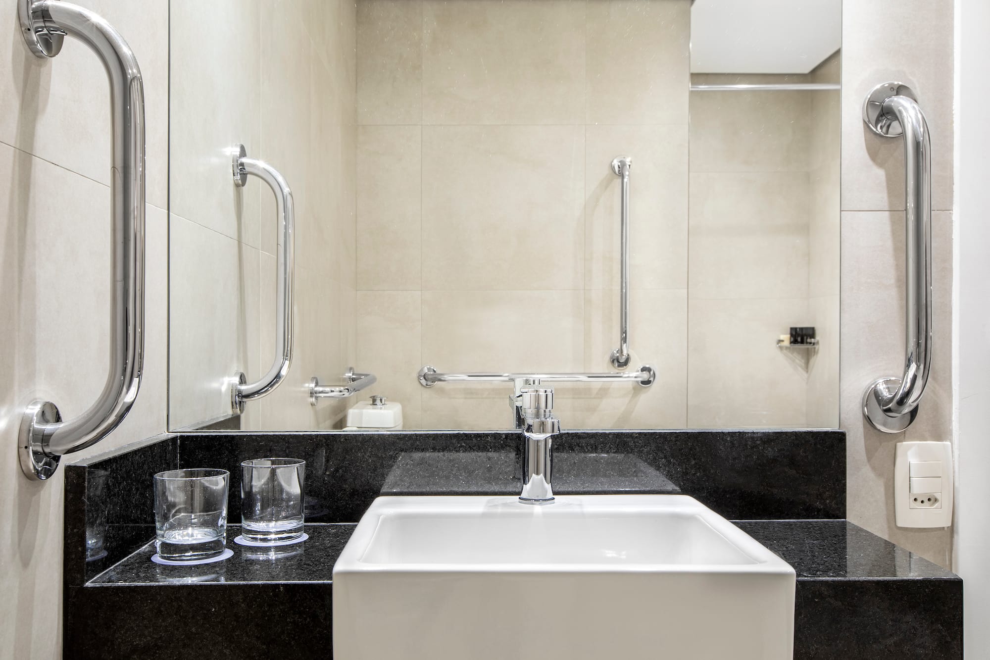 a sink and a mirror in a bathroom