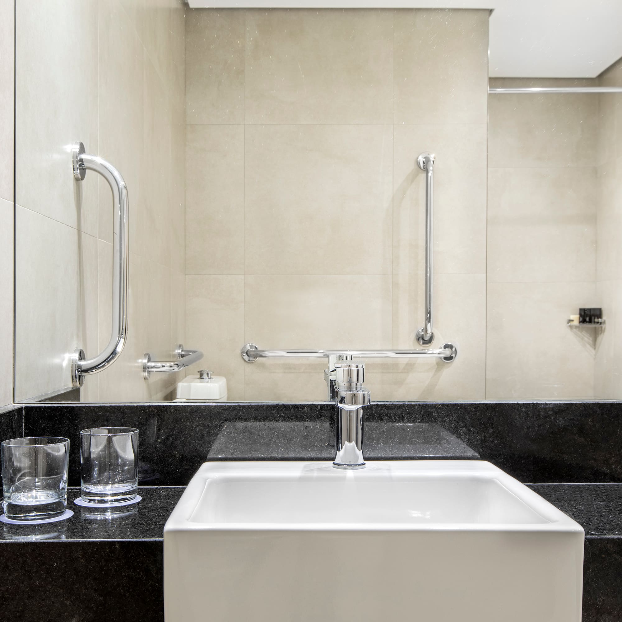a sink and a mirror in a bathroom