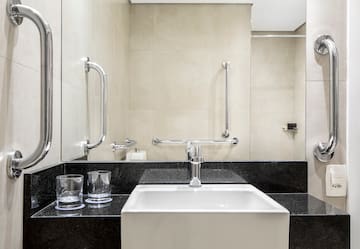 a sink and a mirror in a bathroom