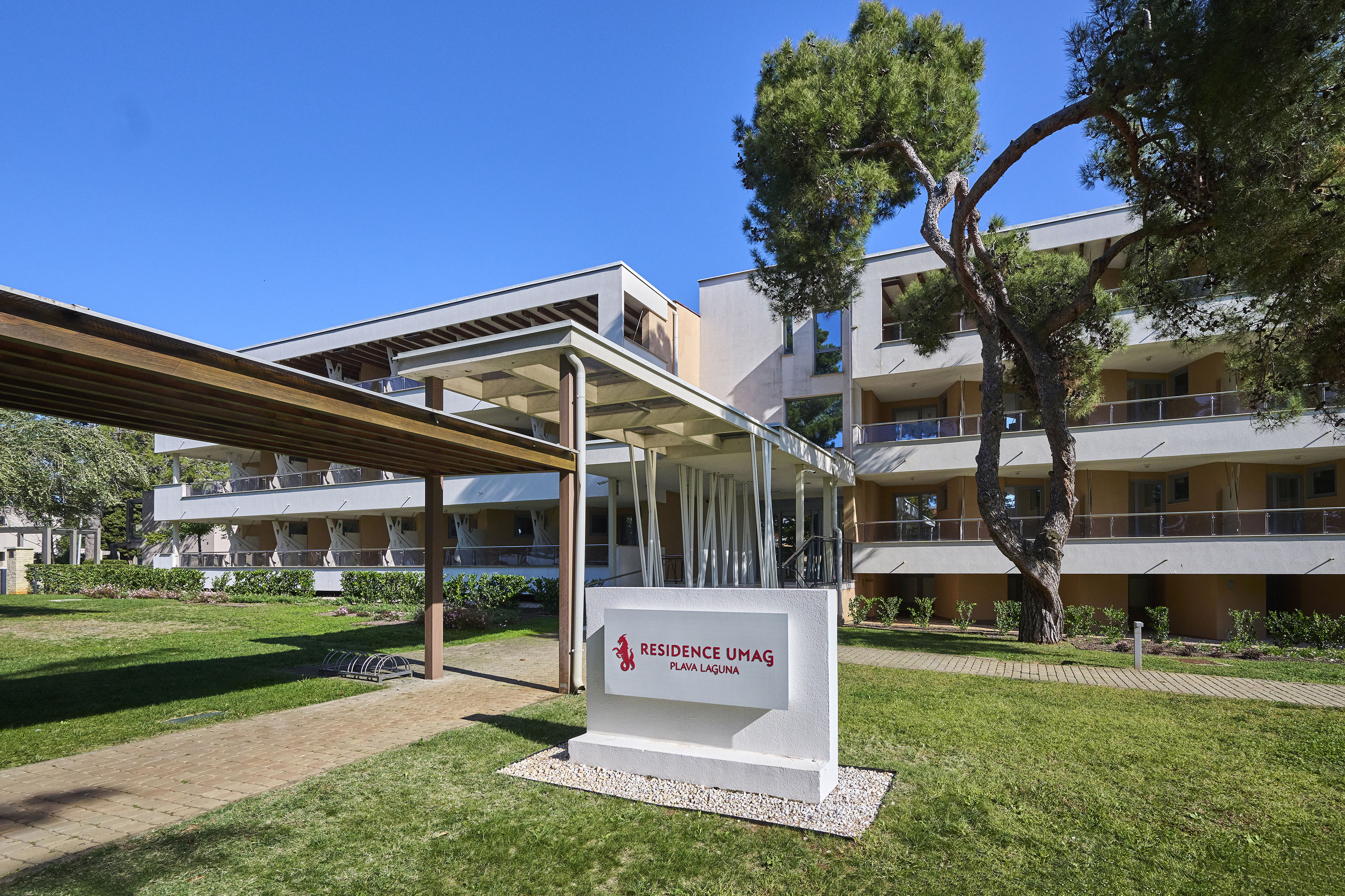 a building with a sign in front of it - Residence Umag Plava Laguna Affiliated by Meliá, Umag